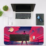 Desk pad with a fighter silhouette in pink and purple against a vibrant pink-to-blue sky. Includes dramatic arena-like background. Desk Mat with an Apple Laptop