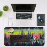 Abstract glitch art of a stylized cityscape with tall buildings silhouetted against a colorful, dreamy sky. Desk Mat with an Apple Laptop