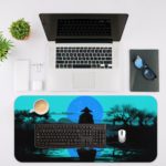 Anime samurai standing in shallow water with a misty landscape and trees, tinted in teal and blue tones. Desk Mat with an Apple Laptop