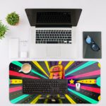 Infidu Classic Chair Animated Desk Pad with Colorful Chair, Bright Rays, Stars, and Circles in Yellow, Blue, Pink, and Green Desk Mat with an Apple Computer