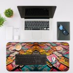 Infidu Vintage Books Design Desk Pad featuring vibrant, multi-colored book art Desk Mat with an Apple Computer