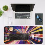 Infidu Artistic Desk Mat with colorful rays radiating from a central point, resembling a burst of light. Desk Mat with an Apple Laptop