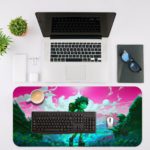 Desk mat featuring an anime boy trekking in a landscape with a pink and purple sky, turquoise sea, and green elements. Desk Mat with an Apple Laptop