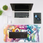 Gaming desk pad with a multi-colored controller on a white background, featuring vibrant paint splashes desk Pad with Antique Video Game Desk Mat with an Apple Computer