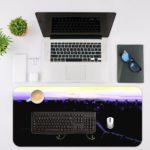 Gaming desk pad featuring a controller in black, navy blue, and yellow on a black background, designed by digital artists for a unique look Desk Pad with Antique Video Game Desk Mat with an Apple Computer