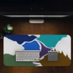 Infidu Artistic Desk Mat with an abstract landscape design in blue, white, green, and brown. Desk Pad in computer table