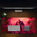 Desk pad featuring Kong on a vibrant pink background, designed by our digital artists. Desk Pad with Design Kept on a computer table