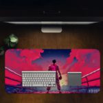 Desk pad with a fighter silhouette in pink and purple against a vibrant pink-to-blue sky. Includes dramatic arena-like background.Desk Pad in computer table