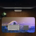 Large blue and white ocean waves against a purplish sky, create a dramatic seascape. Desk Pad in computer table