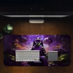 Futuristic gaming-themed desk pad with a VR headset gamer, vibrant outer space background, and dynamic purple, blue, and yellow colors. Desk Pad in computer table