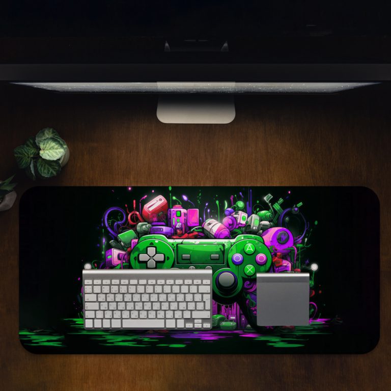 Gaming Desk Pad featuring a colorful controller in blue, orange, and yellow, with a vibrant background of black, green, violet, and red paint splashes Desk Pad with Antique Video Game Design Kept on a computer table