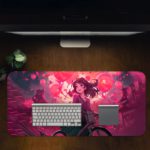 A young girl riding a bicycle against a vibrant pink and purple background with swirling shapes and circles. Desk Pad in computer table