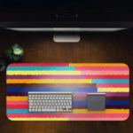 Infidu Artistic Desk Pad with horizontal stripes in pink, yellow, purple, blue, and red. Desk Pad in computer table