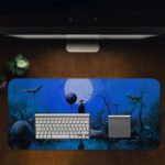 Anime-inspired Infidu Artistic Desk Pad with a blue, foggy scene, barren trees, stones, a full moon, and a mysterious figure on a reflective surface. Desk Pad in computer table