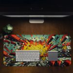 Infidu Color Wave Boom Animated Desk Mat featuring vibrant multi-colored art on gray with yellow accents. Design Kept on a computer table