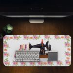 Infidu Modern Stitch Sewing Machine Desk Pad with White Background and Yellow, Pink, and White Flower Corners Design Kept on a computer table