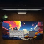 Infidu Space Desk Pad with an astronaut standing on an alien planet, featuring a colorful sky with multiple moons and vibrant colors. Desk Pad on the computer table