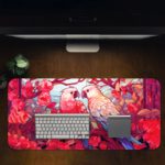 Illustration of two colorful parrots on a branch surrounded by pink and red flowers on the Infidu Artistic Animated Desk Pad Design Kept on a computer table