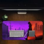 Infidu Artistic Desk Pad with an anime ninja silhouetted in a cityscape, holding a sword, with a background split between purple and red tones. Desk Pad in computer table