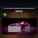 Infidu Artistic Desk Pad with a vintage sports car outlined in glowing purple neon against a dark background, creating a retro-futuristic look. Desk Pad in computer table