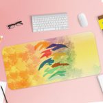 Infidu Artistic Desk Mat with an abstract landscape design in blue, white, green, and brown. Desk Pad with Keyboard and Mouse