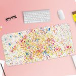 Infidu Artistic Desk Mat with speckled colorful dots in blue, red, yellow, and green on a white background. Desk Pad with Keyboard and Mouse