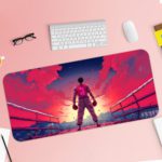 Desk pad with a fighter silhouette in pink and purple against a vibrant pink-to-blue sky. Includes dramatic arena-like background. Desk Pad with Keyboard and Mouse