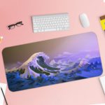 Large blue and white ocean waves against a purplish sky, create a dramatic seascape. Desk Pad with Keyboard and Mouse