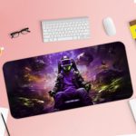 Futuristic gaming-themed desk pad with a VR headset gamer, vibrant outer space background, and dynamic purple, blue, and yellow colors. Desk Pad with Keyboard and Mouse