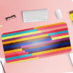 Infidu Artistic Desk Pad with horizontal stripes in pink, yellow, purple, blue, and red. Desk Pad with Keyboard and Mouse