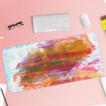 Infidu Artistic Desk Pad with pastel brushstroke patterns in light blue, white, pink, and orange. Desk Pad with Keyboard and Mouse