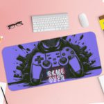 Gaming desk pad with black and blue controller design of Antique Video Game on a desk pad