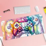 Gaming desk pad with a multi-colored controller on a white background, featuring vibrant paint splashes Design of Antique Video Game on a desk pad