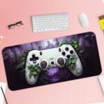 Gaming desk pad featuring a colorful game controller against a green, black, and violet background with dynamic paint splashes Design of Antique Video Game on a desk pad