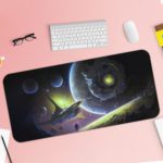 Infidu Space Desk Mat featuring multiple planets and a spacecraft against a deep space background with stars, in shades of blue and green. Desk Pad with Keyboard and Mouse