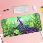 Illustration of a bright purple peacock on a branch with a background of green leaves on the Infidu Artistic Animated Desk Pad with Keyboard and Mouse