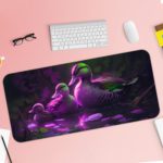 Artistic desk pad with a glowing duck family in purple and green on a dark background with water reflections. Desk Pad with Keyboard and Mouse