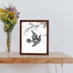 vintage art print of the Hondo Great Spotted Woodpecker by Numata Kashu, kept on a table with brown frame