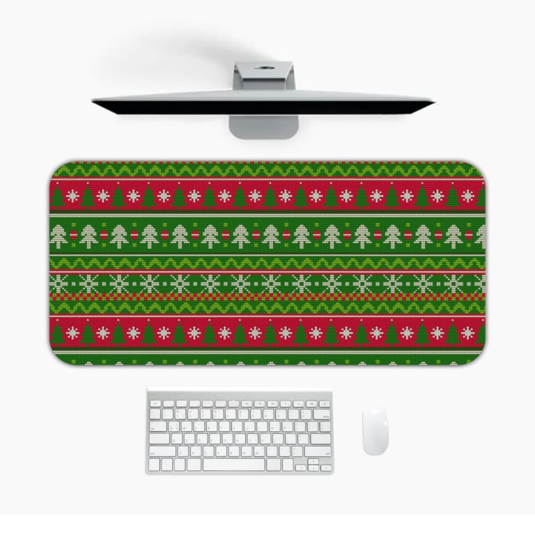 Infidu Knitted Pattern Desk Pad with green background, Christmas trees, snowflakes, and red stripes for a festive holiday feel. Design Kept on a computer table