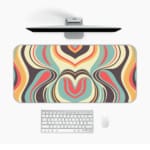 Infidu Geometric Pattern Art Desk Pad with swirling, pastel wave patterns in yellow, green, pink, and blue. Desk Pad in computer table