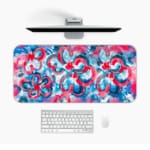 Infidu Desk Pad with vibrant pink and blue swirls, creating an energetic and eye-catching design. Desk Pad in computer table