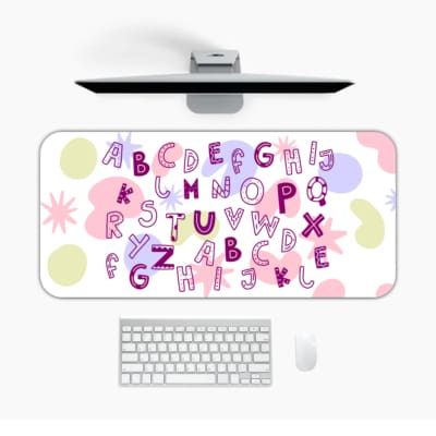 Infidu Alphabet Desk Pad with a white background featuring colorful letters and star shapes in various styles and colors. Desk Pad in computer table