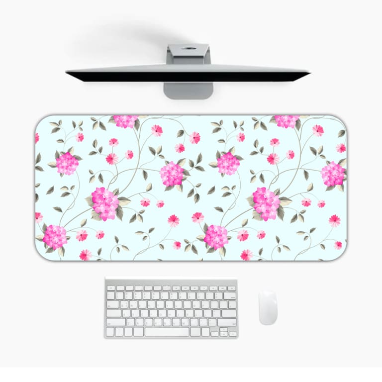 Light mint green desk mat with large pink roses and green leaves, offering a unique and charming touch to your workspace. Desk Mat with a computer