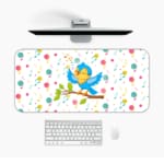 Infidu Lovely Singing Parrot Desk Pad with a white background and musical design, featuring a vibrant comic-style illustration. Desk Pad Design Kept on a computer table