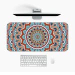 Infidu Desk Pad featuring intricate mandala design with blue background and vibrant orange, red, and white details. Desk Pad in computer table