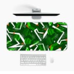 Infidu Desk Pad features green geometric patterns on a dark background, adding a stylish and durable touch to any workspace. Desk Mat with a laptop