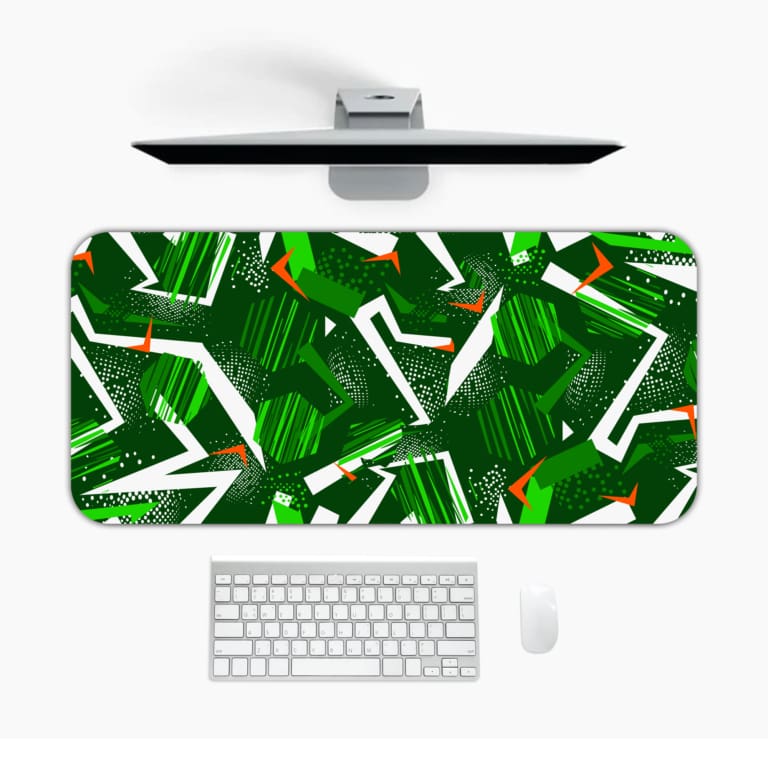 Infidu Desk Pad features green geometric patterns on a dark background, adding a stylish and durable touch to any workspace. Desk Mat with a laptop