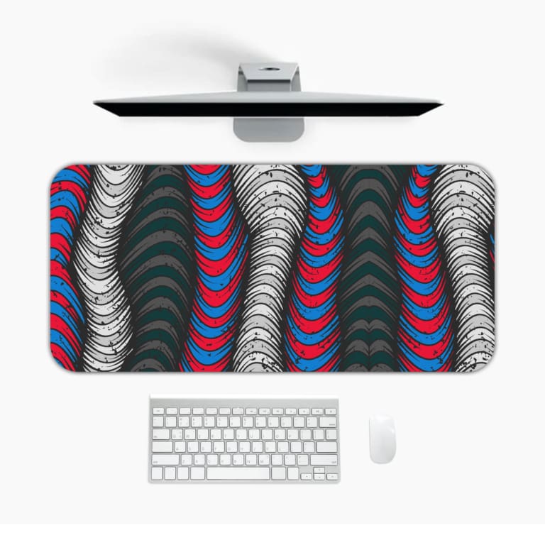 Infidu Vector Pattern Desk Pad featuring wavy lines in gray, red, and teal on a dark gray or black background. Desk Mat with a laptop