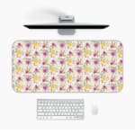 White desk mat with a medium-sized floral pattern in pink, yellow, and purple flowers, adding a vibrant and creative touch to your desk. Desk Pad on the computer table