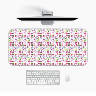 White desk mat with a small, densely packed floral pattern featuring pink, purple, and yellow flowers for a unique desk touch. Desk Pad Design Kept on a computer table